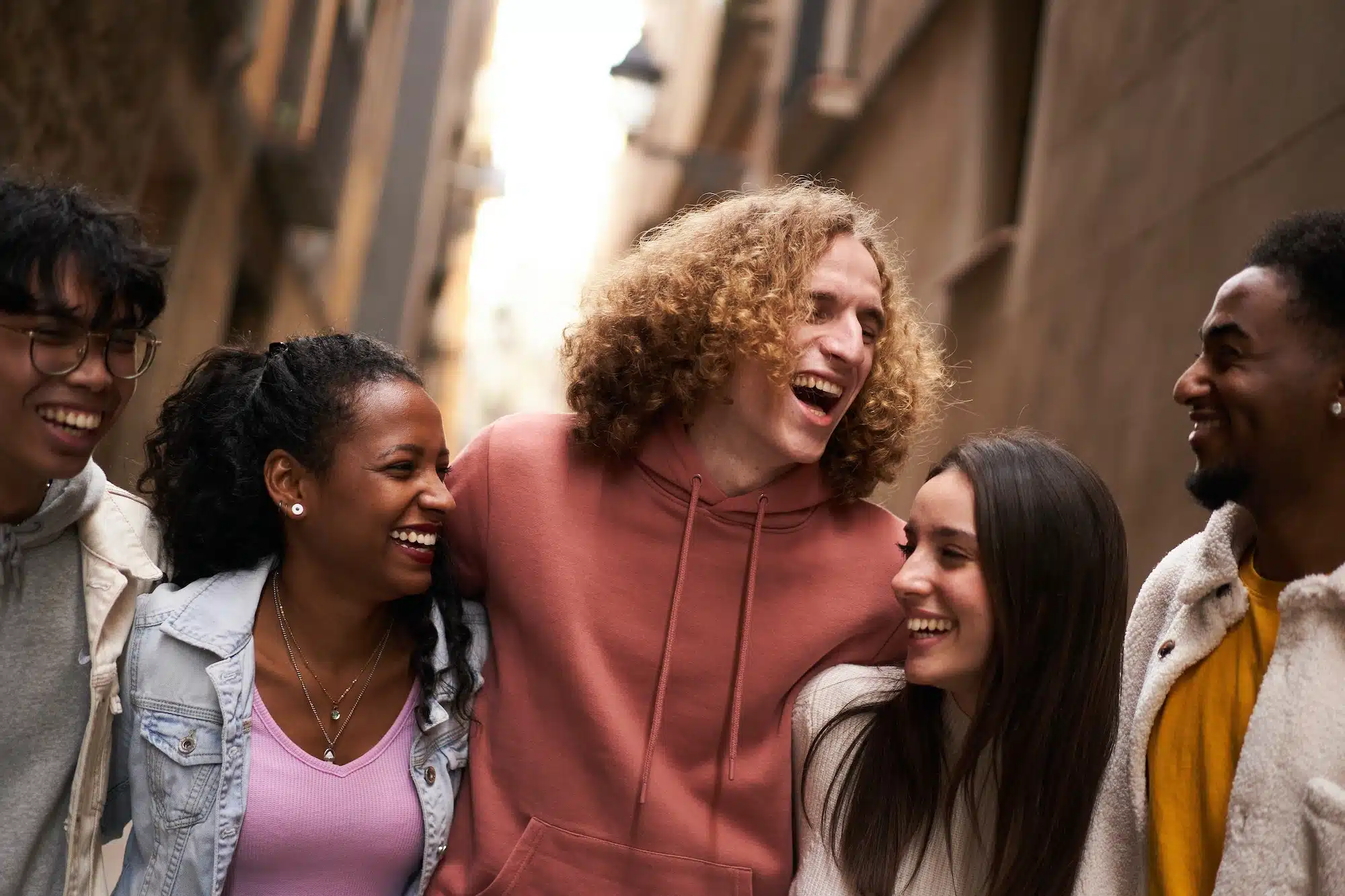 Group Of Happy Friends Having Fun Together Outdoors. Mixed race people laughing making community.